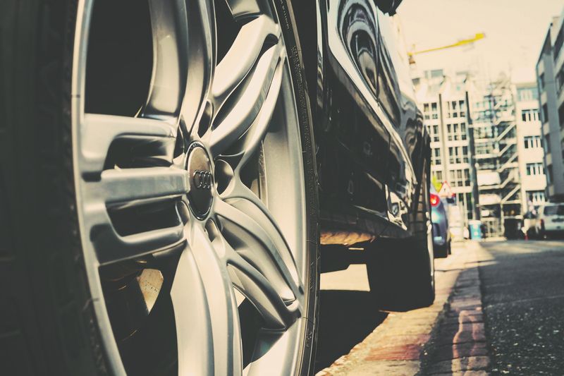 A dull, road soiled alloy wheel before treatment